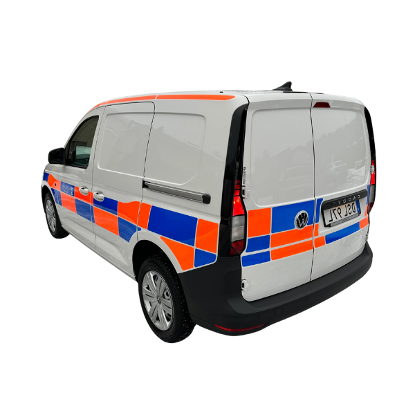 Skåpbil med reflexvinyl i battenburgmönster – referens för tryck och skärning av arbetsfordonsdekor.